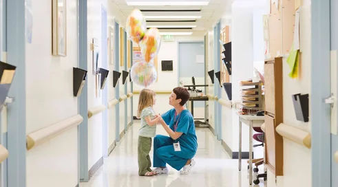 Doctor with girl in hospital